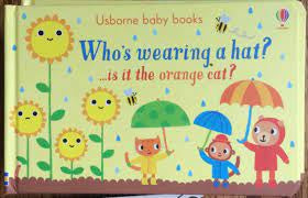 Who's Wearing a Hat? ... Is it the Orange Cat? Board Book